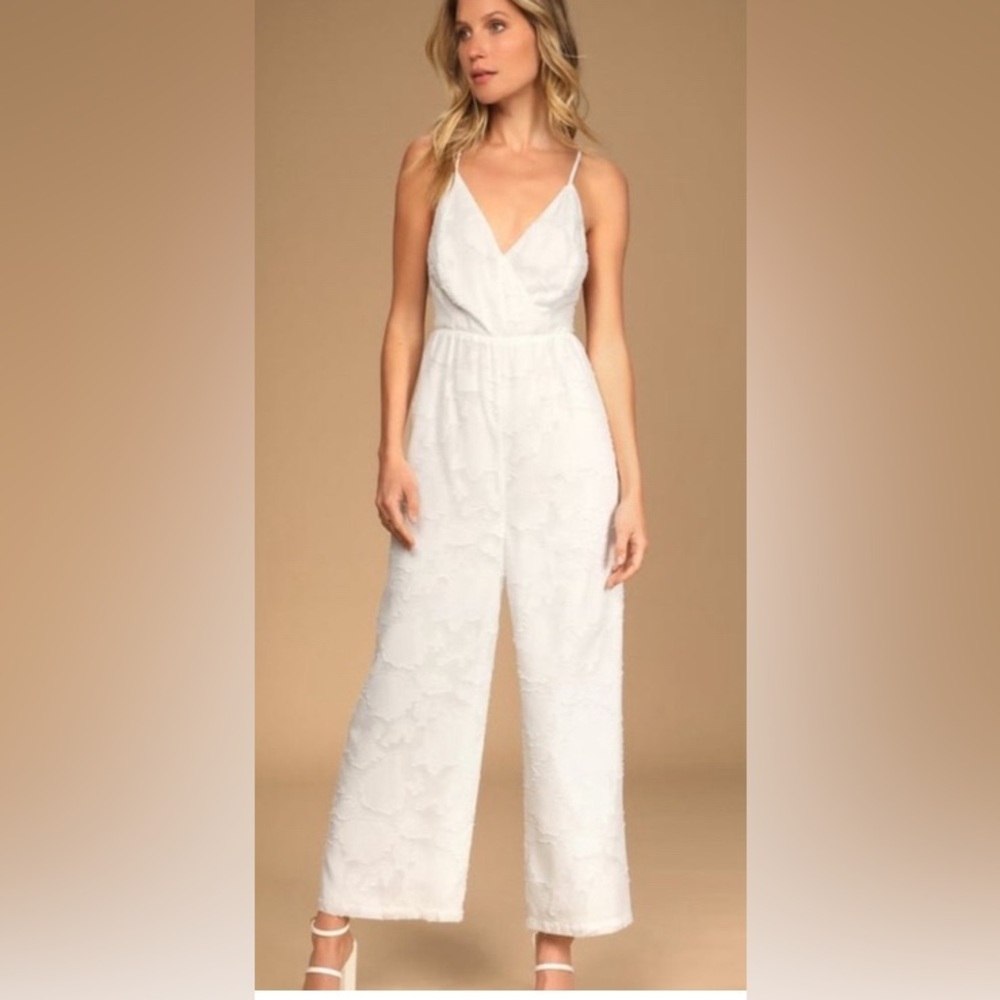 Lulus size medium jumpsuit, white double lined floral. Adjustable straps…